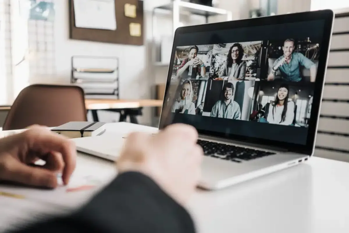 Video conference with multiple participants on a laptop